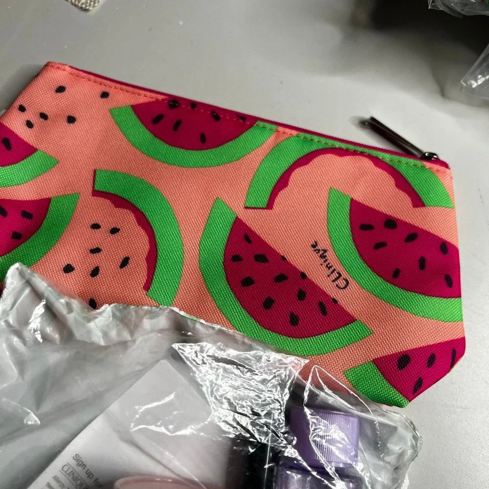 Clinique x Donald Robertson Watermelon Makeup Bag & 6pc Travel Skincare Gift Set